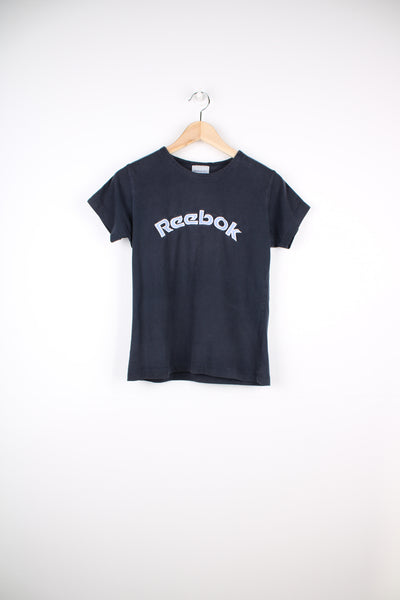 Y2K navy blue Reebok baby tee style t-shirt with embroidered spell out logo on the chest and stripe ribbon detail down the arms. good condition Size in Label: Womens 12 (L)