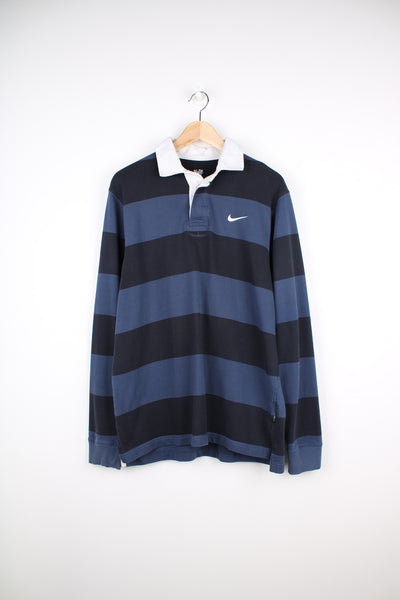 00's Nike Athletic Dept. rugby shirt. Features white embroidered swoosh logo on the chest and navy blue horizontal stripe design. good condition Size in Label: Mens L 