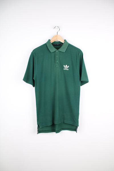 Vintage Adidas green polo shirt with embroidered logo on the chest. good condition Size in Label: 38/ 40 - Measures like a mens S
