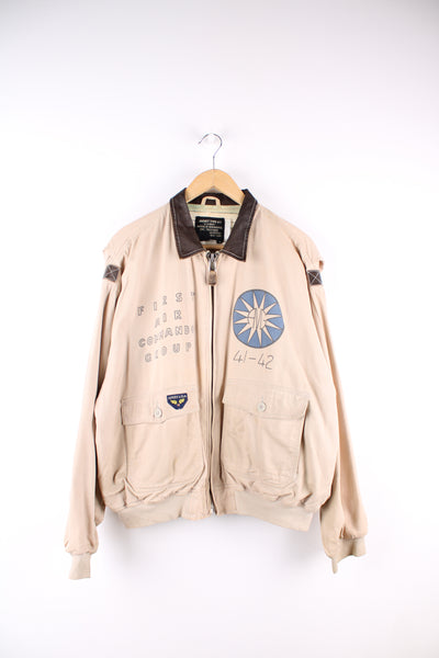 Vintage Avirex type G-1 tan cotton flight jacket with all over printed details and embroidered badge on the pocket