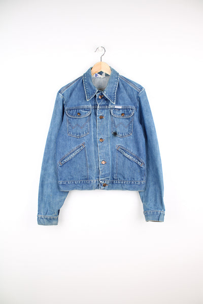 Vintage 70's  Wrangler 'no fault' 100% cotton denim jacket in blue with signature 'W' embroidered on the pockets and logo embroidered on the chest.  