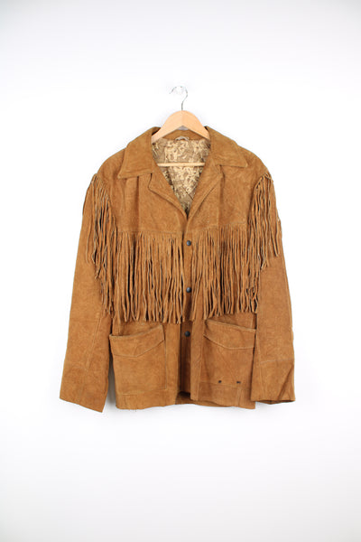 Vintage tan suede leather jacket by J bar C with fringe details on the front and down both sleeves 