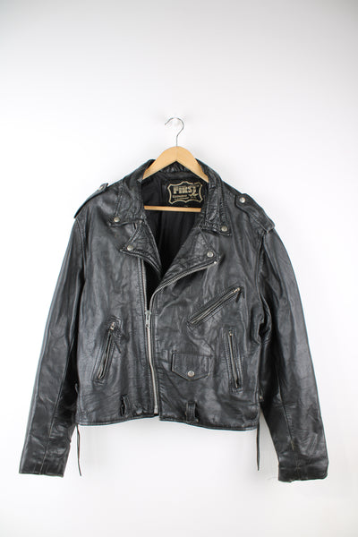 Vintage First biker jacket made from 100% genuine leather, features multiple zip up pockets, lace up details on the hips