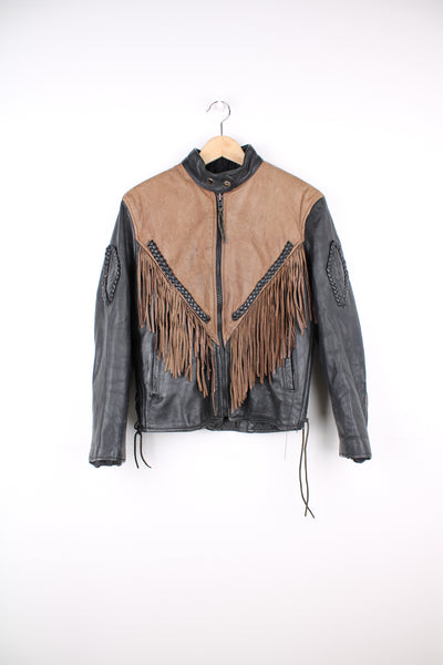 Vintage 80's black and brown fringe motorcycle leather jacket. Features a cropped fit,  fringe detailing on the sleeves and across the back of the shoulder 