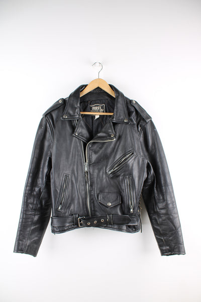 Vintage First biker jacket made from 100% genuine leather, features multiple zip up pockets, lace up details on the hips and chunky belt