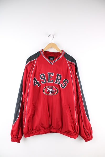 Vintage NFL San Francisco 49ers drill top in red and black team colourway, v neck, side pockets and logo embroidered on the front and back. 