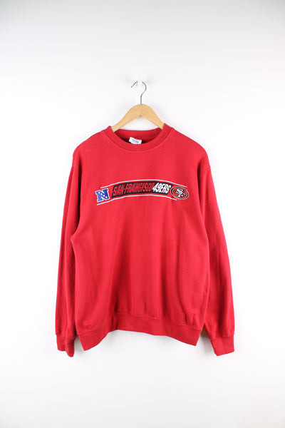 Vintage NFL San Francisco 49ers sweatshirt in red, black and white team colourway, crewneck with embroidered spell out and logo on the front.