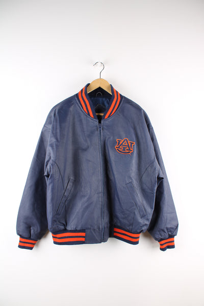 Vintage Auburn Tigers College Football Varsity Jacket in a blue and orange colourway, zip up with side pockets, quilted lining and embroidered logos on the front and back. 
