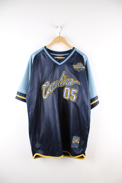 Vintage Y2K Fubu City Series Collection, Carolina jersey in a blue and yellow colourway, v neck with embroidered logos and Fubu number 5 on the back. 