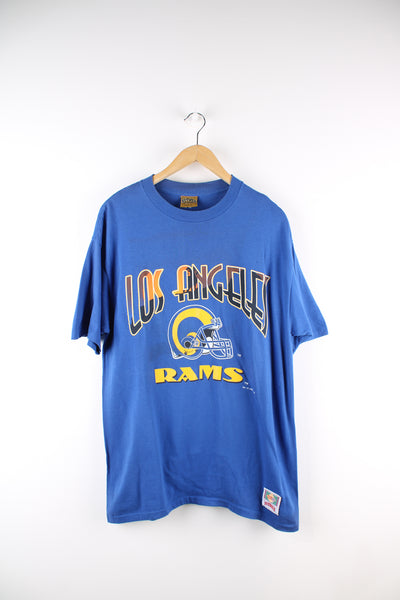 Vintage 1993 NFL Los Angeles Rams single stitch t-shirt in the blue and yellow team colourway, Nutmeg label, has printed spell out and logo across the front.
