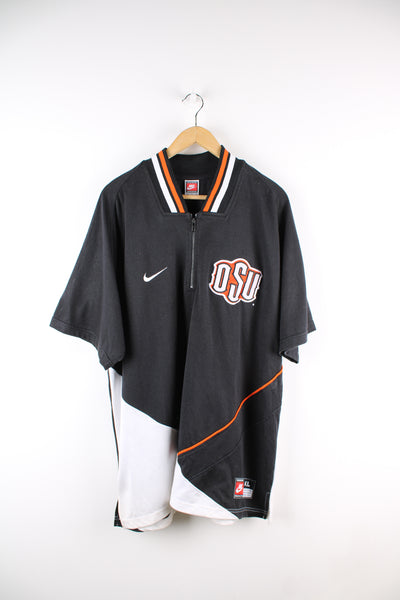 Vintage Ohio State University, Nike training top in the black, orange and white team colourway, quarter zip up with embroidered logos on the front. 
