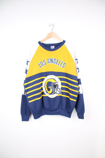 Vintage 80's Los Angeles Rams sweatshirt with printed graphic on the front, sleeves and back. Made by Garan. good condition - cracking to the graphic and some light bobbling (see photos) Size in Label: Mens XL 