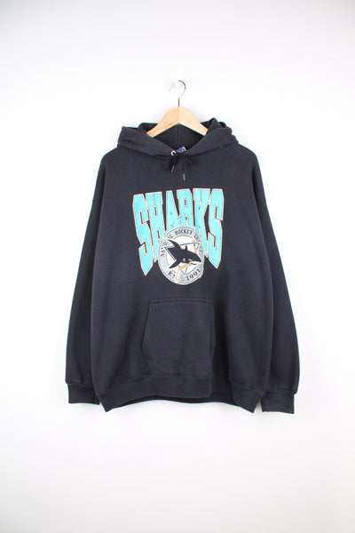 Vintage 90's San Jose Sharks hoodie with printed team logo on the front. Made by Lee Sport. good condition - black colour is slightly faded and there is some cracking to the graphic (see photo) Size in Label:  Mens XL