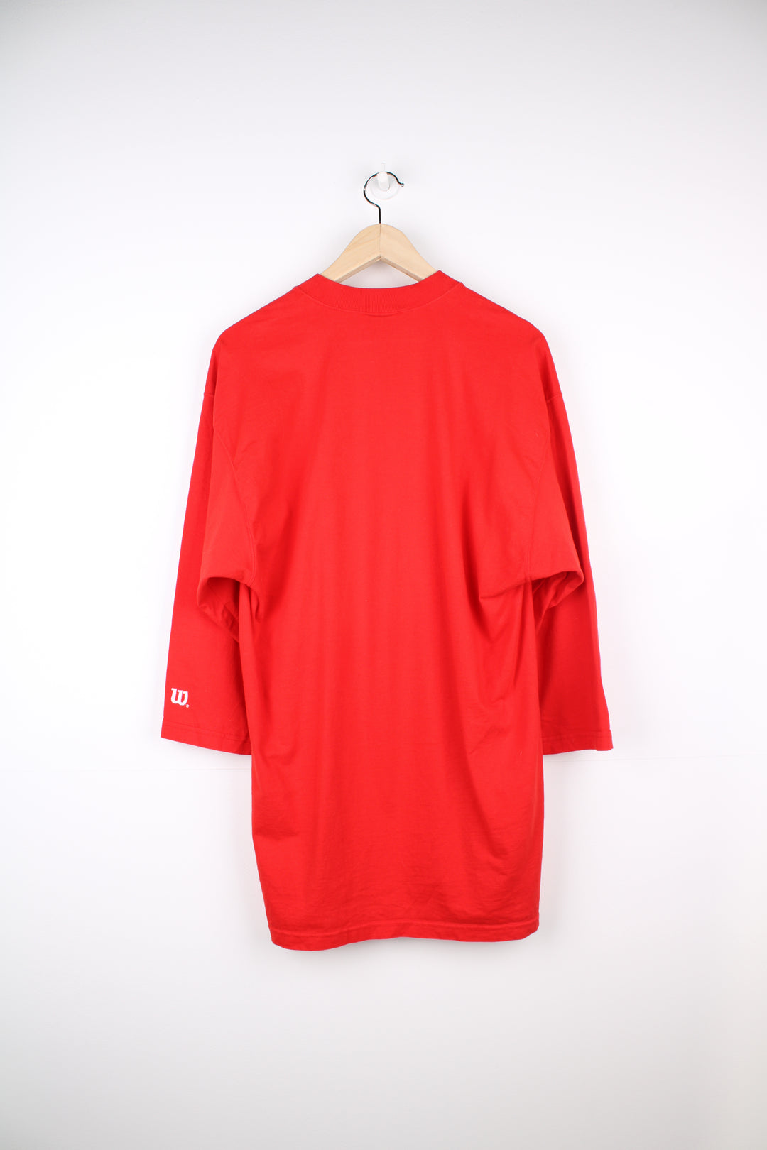 Vintage Wilson T-Shirt in a red and white colourway, crewneck with quarter length sleeves, has logo spell out printed across the front.