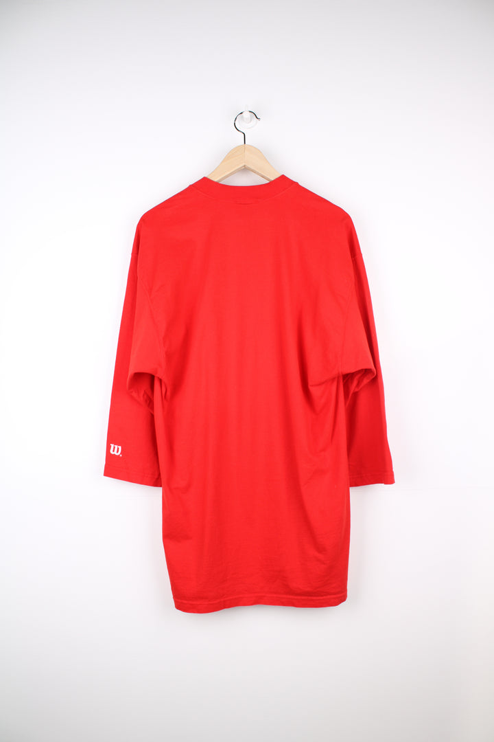 Vintage Wilson T-Shirt in a red and white colourway, crewneck with quarter length sleeves, has logo spell out printed across the front.
