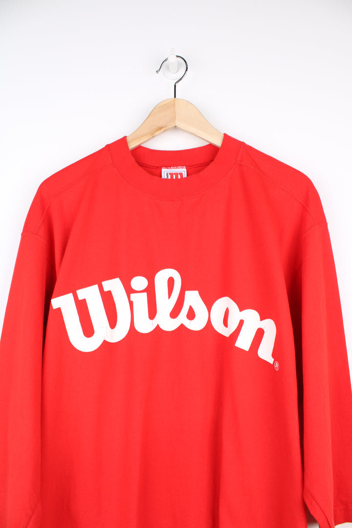 Vintage Wilson T-Shirt in a red and white colourway, crewneck with quarter length sleeves, has logo spell out printed across the front.