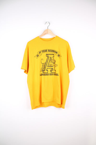 Vintage 90's Alamogordo High School T-Shirt in a yellow colourway with tiger graphic design printed on the front, Hanes label and is single stitch.