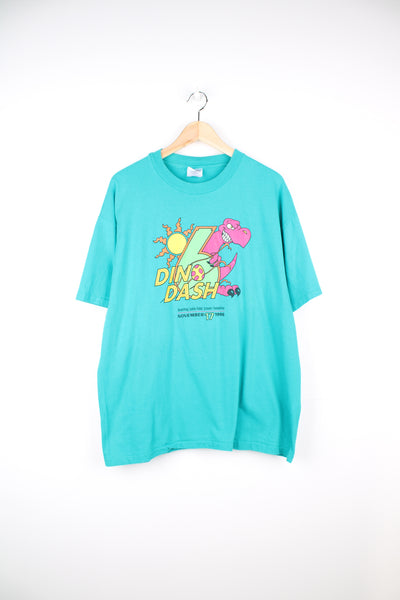 Vintage 90's Dino Dash T-Shirt in a blue colourway with a dinosaur graphic design printed on the front, Hanes beefy label and is single stitch.