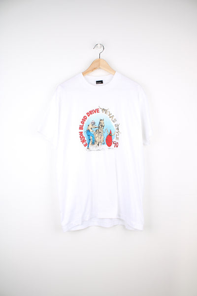 Vintage 90's Exxon Blood Drive, Texas Style T-Shirt in a white colourway with cowboy graphic design printed on the front, screen star best label and is single stitch.