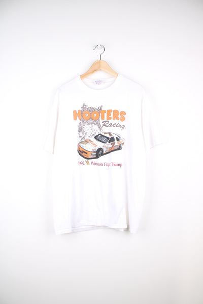 Vintage 1992 Hooters Racing, Winston Cup Champion T-shirt in a white colourway with Hooters owl and race car graphic print on the front, made in U.S.A Hooters label and is single stitch.