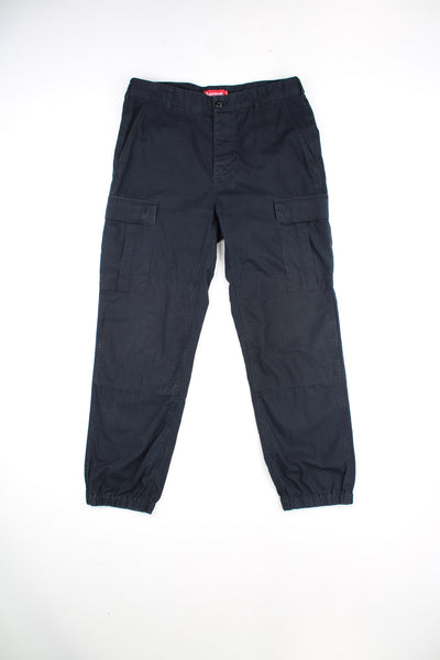 Supreme all black cargo trousers with adjustable straps on the waistband and multiple pockets