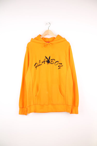 Supreme x Playboy 100% cotton hoodie in orange, made in Canada. Features embroidered spell-out logo across the chest