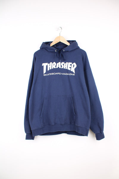 Thrasher skater hoodie in navy blue, features white spell-out graphic on the front