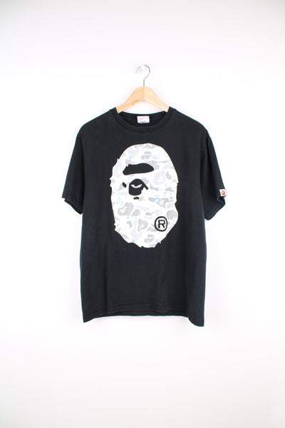 Bape black tee, features marbled effect graphic on the front