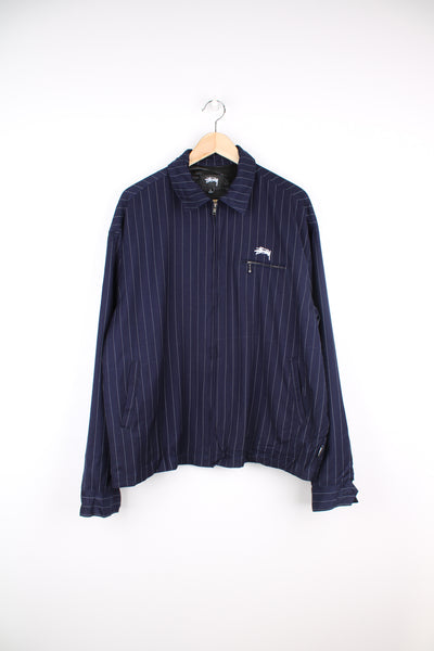 Stussy x Comme Des Garcon blue pinstripe zip through jacket, features embroidered logo on the chest and back of the collar