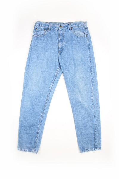 Carhartt traditional fit light blue denim jeans with signature leather logo on the back pocket