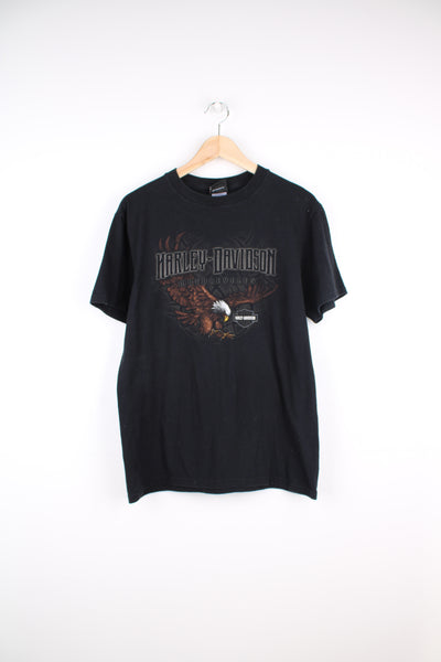 2006 Harley Davidson t-shirt in black with printed Harley logo print on the front and "California" print on the back. good condition- cracked print on the back Size in Label: Mens M - Measures more like a S