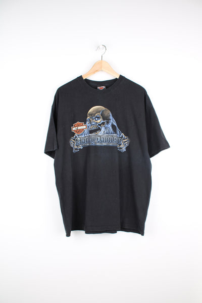 Harley Davidson t-shirt in black with printed skull graphic on the front and flaming Harley logo on the back. good condition - light line mark on the front under the skull graphic (see photos) Size in Label: Mens XL- Measures more like a L