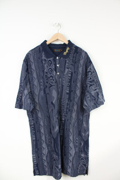 Vintage Coogi blue patterned oversized polo shirt with embroidered logo on the collar