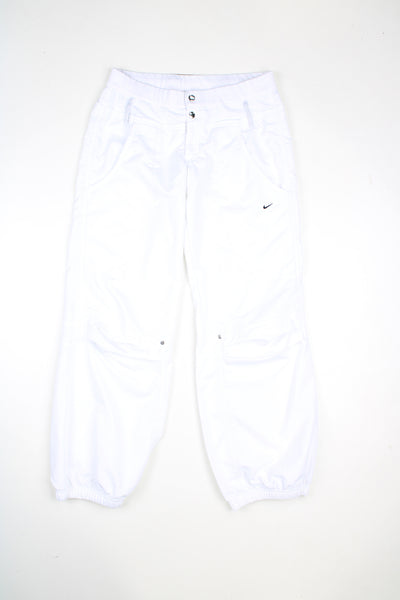 Vintage Nike tracksuit bottoms in a white colourway, elasticated waist, multiple pockets and has logo embroidered on the front.