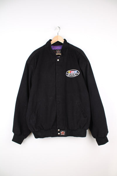All black, cotton NASCAR 2000 bomber jacket. Features embroidered NASCAR logo on the front and back. Closes with popper buttons down the front. good condition Size in Label: Mens XXL
