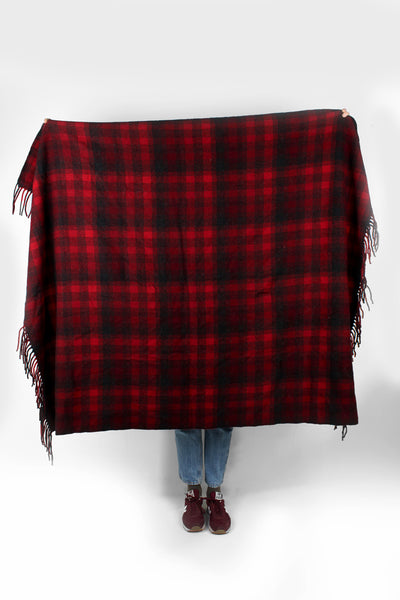 Vintage Pendleton check/ plaid wool blanket in red and black colourway. Made from 100% virgin wool and features fringe down two of the sides. good condition  Size in Label:  Width: 58 inches Length: 53 inches