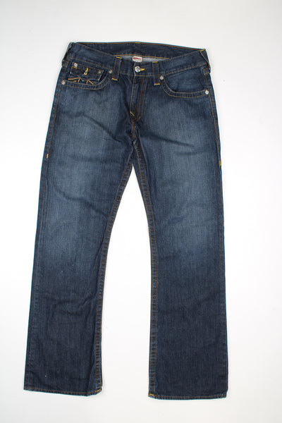 Vintage True Religion mid rise bootcut jeans with contrast stitching.  good condition - distressed at the cuffs (see photos)  Size in Label:   33