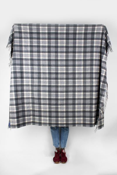 Vintage Pendleton check/ plaid wool blanket in grey colourway. Made from 100% virgin wool and features fringe down two of the sides. good condition - black parts have some bobbling Size in Label: Width: 54 inches Length: 69 inches 