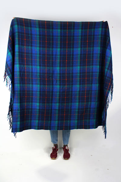 Vintage Pendleton check wool blanket in blue colourway. Made from 100% virgin wool and features fringe down two of the sides. good condition - black parts have some bobbling Size in Label: Width: 54 inches Length: 69 inches