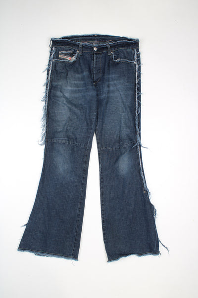 Diesel low rise bootcut jeans with distressed hem detail.  good condition  Size in Label:  31 (L)