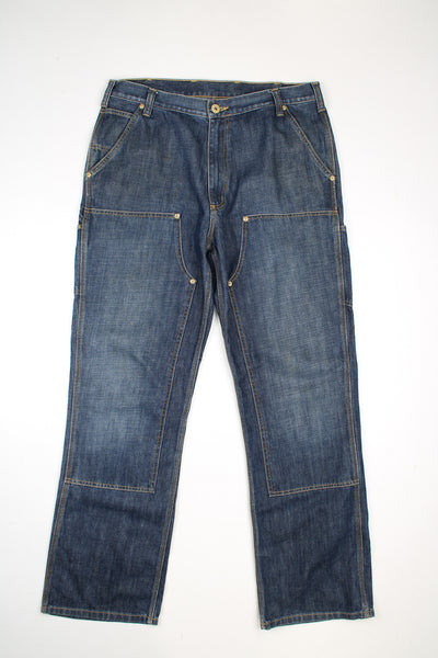 Carhartt blue denim double front logger style jeans with multiple pockets and contrast stitching
