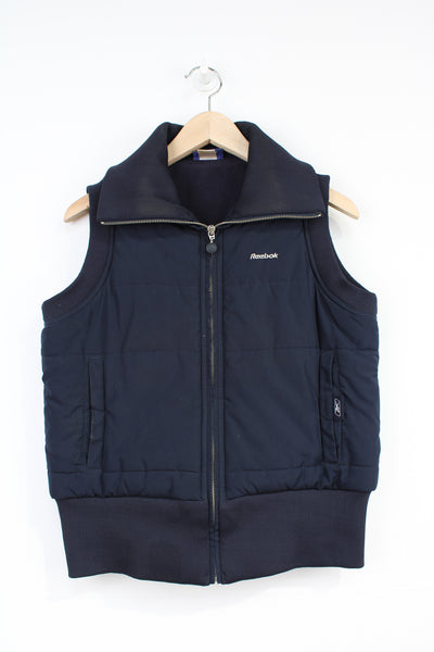 Reebok navy blue zip through puffer gilet, with pockets and embroidered logo on chest