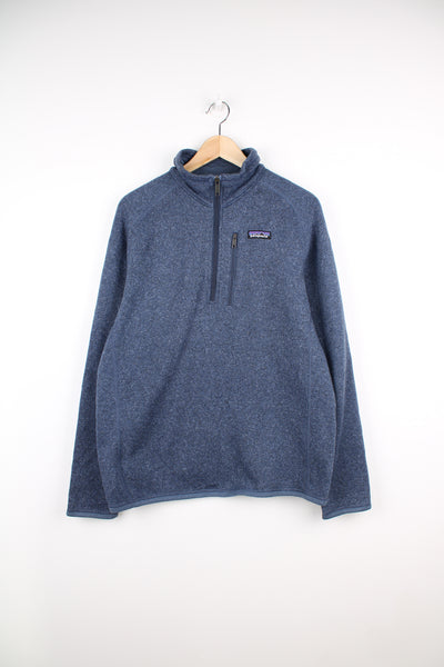 Patagonia Fleece in a blue colourway, half zip up, chest pocket, and has logo embroidered on the front.