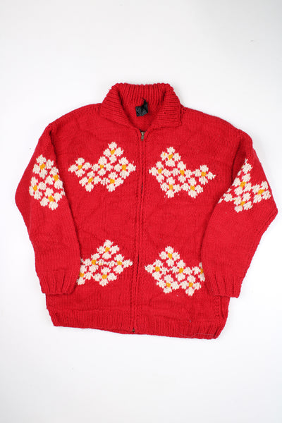 Vintage red knit cardigan with white daisy design. Made by the brand Otavalo in Ecuador from 100% wool and closes with a full zip.  good condition  Size in Label:  N/A- measures like a M