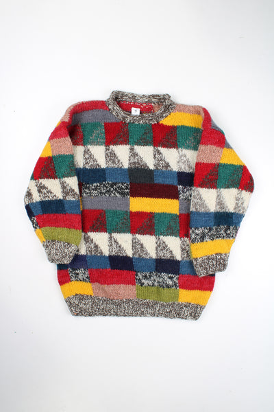 Vintage multicoloured knit jumper with geometric design. Made by the brand Ends of the Earth in Nepal from 100% wool.  good condition - mark on the arm (see photos)  Size in Label:  N/A- measures like an M