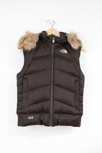 The North Face 550 brown satin gilet with faux fur trimmed hood and embroidered logo on the front & back