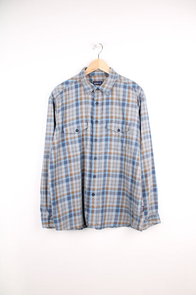 Patagonia Plaid Shirt in a blue and brown colourway, button up, double chest pockets and has the logo embroidered on the side.