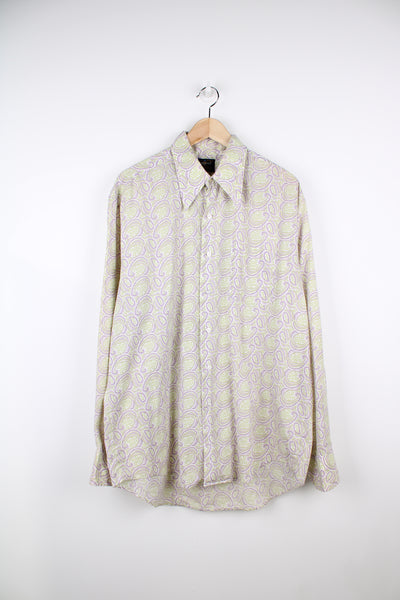 Vintage 70's long sleeve button up shirt in purple and lime green paisley pattern. Features a dagger collar. good condition Size in Label: XL 17/ 17 Measures like a mens XL