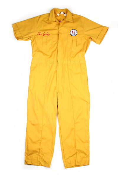 Yellow short sleeved cotton jumpsuit with chain stitched embroidered detail on the front chest and the back. Embroidery says "Almas Clowns Washington DC" on the back and "The Judge" on the front. Also has a "Almas Temple Clowns" patch.  good condition - one small mark (see photos)  Size in Label:  Mens 46 - Measures like a mens XXL