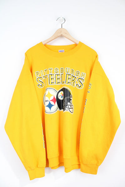 NFL Pittsburgh Steelers yellow Sweatshirt with embroidered spell-out across the front.